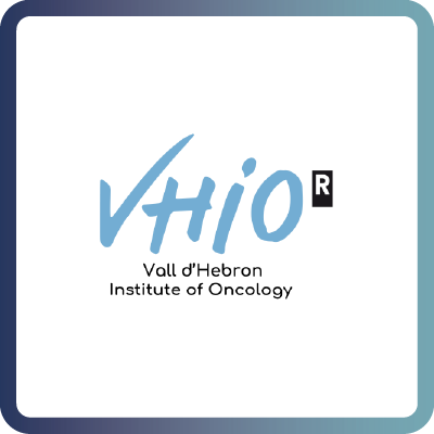 A tile with dark blue border and white background containing the logo of the The Vall dâHebron Institute of Oncology (VHIO)